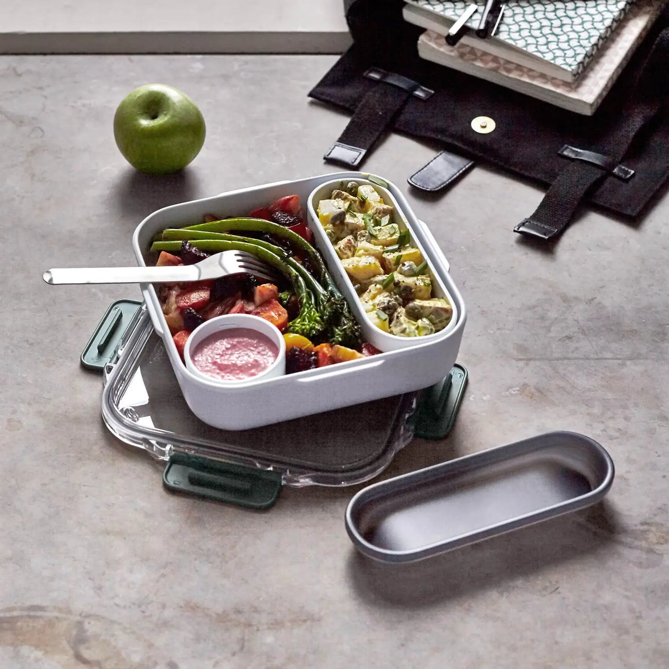 A Black & Blum Work Lunchbox filled with veg, pasta and a sauce pot.