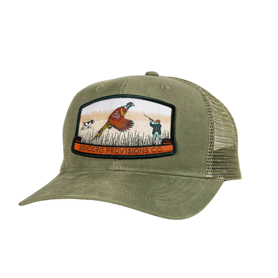 A rustic khaki cap with mesh back, featuring a front patch depicting a hunting scene with a pheasant, pointer dog and hunter.